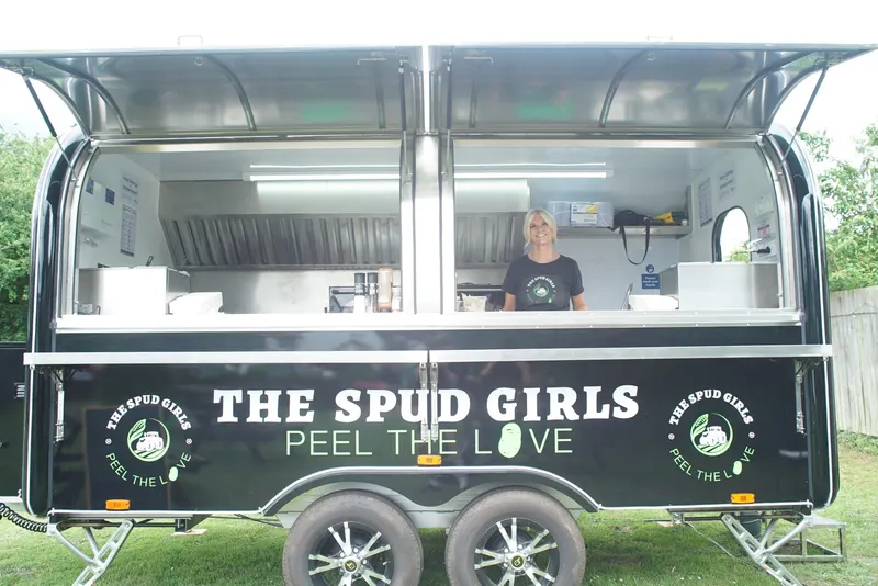 The Spud Girls trailer set up on grass