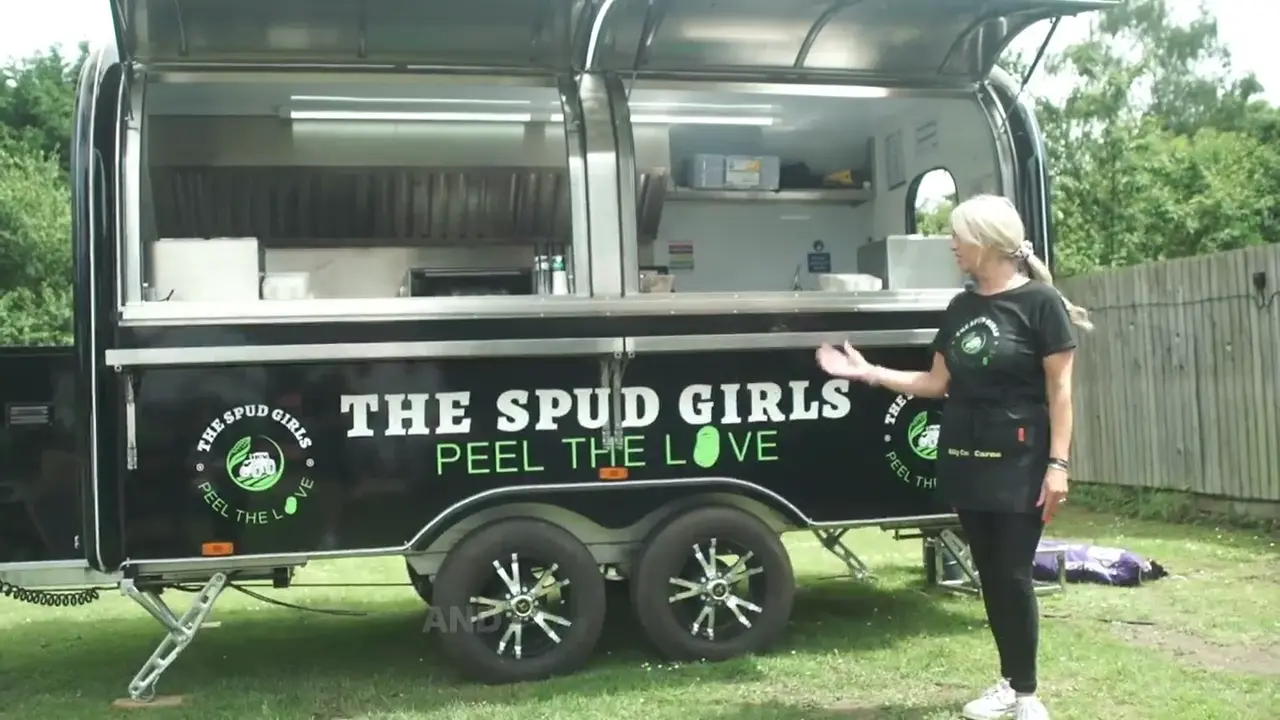 Gill standing beside the trailer